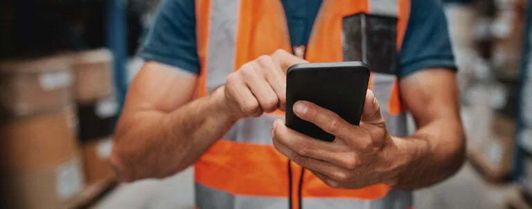 hands using tablet in warehouse